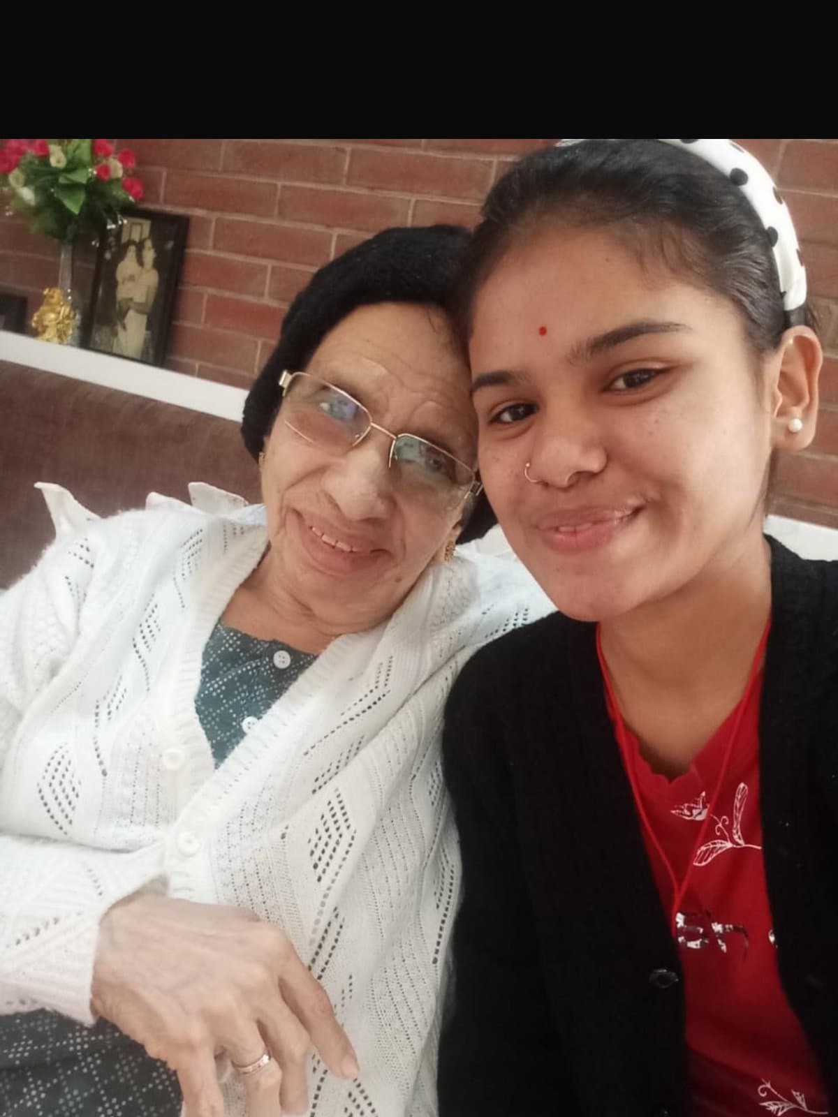 A caregiver with an elderly patient at home