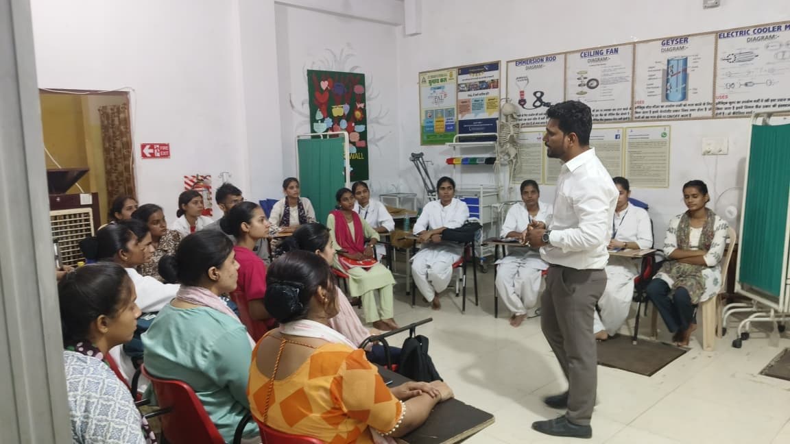 A batch of caregiver trainees in class with Devendra Lalawat